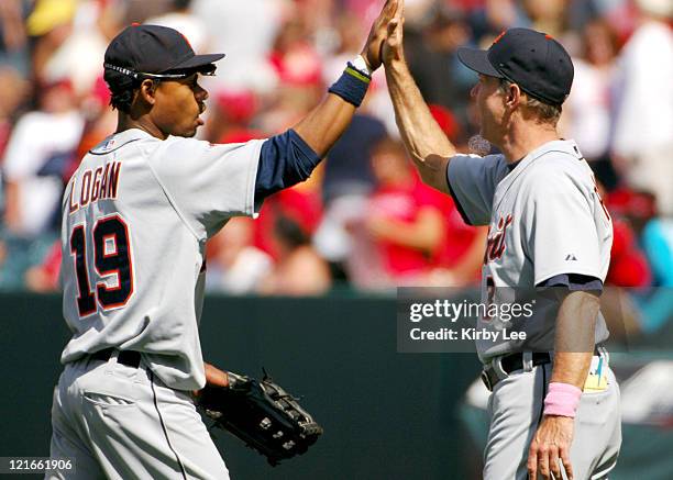 Detroit Tigers manager Alan Trammell exchanges high five with Craig Monroe after 10-1 victory over the Los Angeles Angels of Anaheim at Angel Stadium...