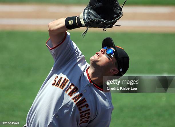 Snow of the San Francisco Giants chases a foul ball during 4-1 victory over the Los Angeles Dodgers at Dodger Stadium in Los Angeles, Calif. On...