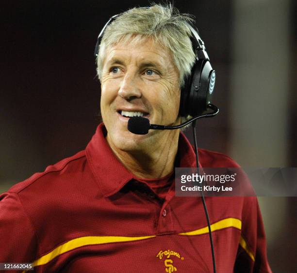 Coach Pete Carroll smiles on the sidelines during 42-0 victory over Stanford in Pacific-10 Conference football game at Stanford Stadium in Stanford,...