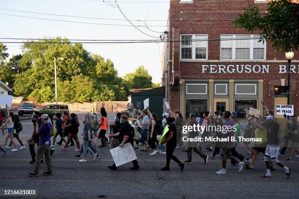 Protesters demonstrate down South Florissant Road prior to a protest at the Ferguson Police Department on May 31, 2020 in Ferguson, Missouri. Major...