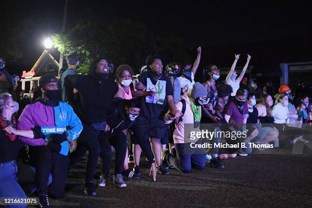 Protesters demonstrate at the Ferguson Police Department on May 31, 2020 in Ferguson, Missouri. Major cities nationwide saw demonstrations over the...