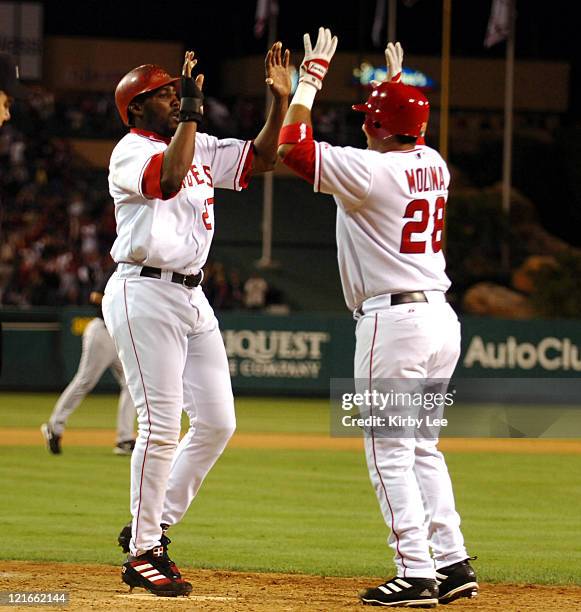 Vladimir Guerrero of the Los Angeles Angels of Anaheim is congratulated by Bengie Molina after scoring the winning run in 3-2 victory over the...