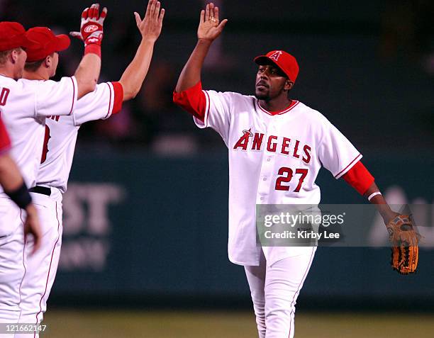 Vladimir Guerrero of the Los Angeles Angels of Anaheim, who was 2 for 4 with four RBI's including a two-run first-inning home run exhanges high fives...