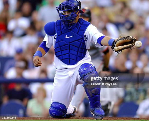 Los Angeles Dodgers catcher Dioner Navarro misplays a throw to home plate in the fifth inning that allowed Ray Durham of the San Francisco Giants to...