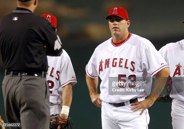 Los Angeles Angels of Anaheim reliever Brendan Donnelly stands on the mound after his glove was confiscated by umpires because of pine tar on the...