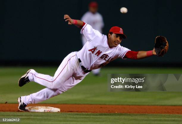Maicer Izturis stretches for a throw to second base during 4-3 loss to the Kansas City Royals at Angel Stadium in Anaheim, Calif. On Wednesday, June...
