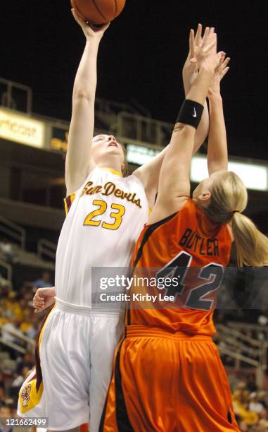 Kirsten Thompson of Arizona State shoots over Kim Butler of Oregon State during Pacific-10 Tournament Quarterfinal at the HP Pavilion in San Jose,...