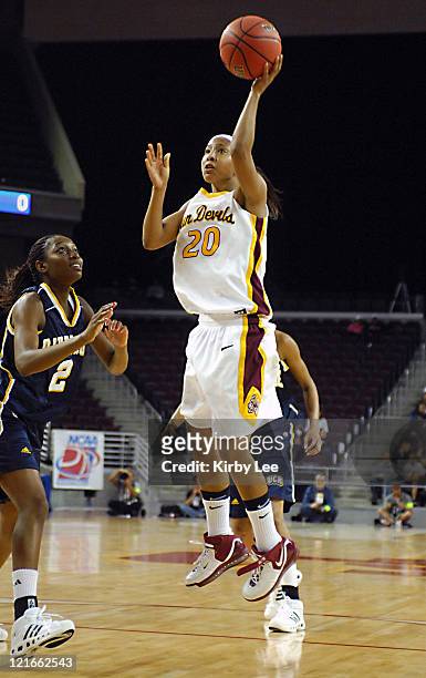 Briann January of Arizona State shoots as Seyram Gbewonyo of UC Riverisde looks on during NCAA Women's Basketball Tournament playoff game at the...