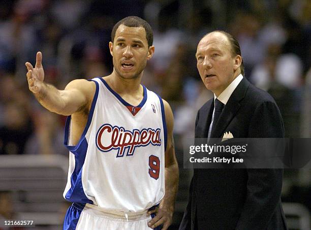 Rick Brunson of the Los Angeles Clippers talks to coach Mike Dunleavy during the 134-127 double overtime loss to the Boston Celtics at the Staples...