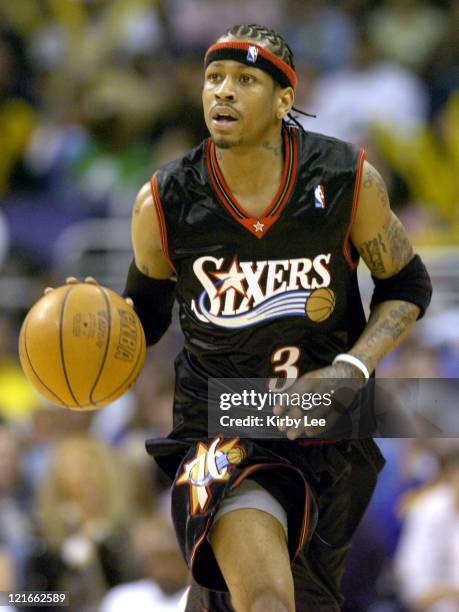 Allen Iverson of the Philadelphia 76ers brings the ball up the court during the NBA game between the Los Angeles Lakers and the Philadelphia 76ers at...