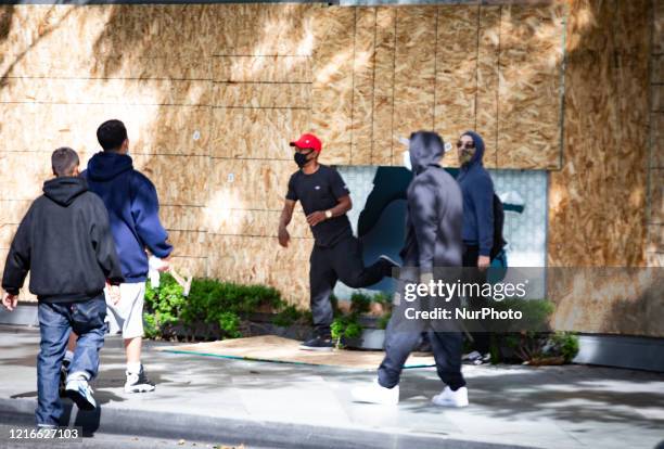 Looters rob a Nordstrom store as protestors face off with police, as unrest continues in the wake of the death of George Floyd in Minneapolis, in...