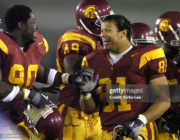 Alex Holmes and Frostee Rucker of USC celebrate during 49-9 victory over Arizona in Pacific-10 Conference football game at the Los Angeles Memorial...