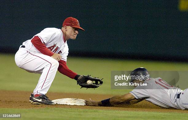 Coco Crisp of the Cleveland Indians slides into second beneath tag of David Eckstein of the Anaheim Angels in the fourth inning of 8-5 victory at...