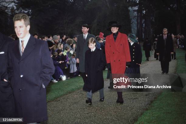 British royals Peter Phillips, Prince William, and Diana, Princess of Wales , wearing a red coat with a black hat, attend the Christmas Day church...