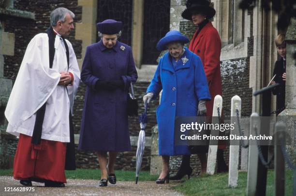 British royals Queen Elizabeth II, Queen Elizabeth The Queen Mother and Diana, Princess of Wales , wearing a red coat with a black hat, attend the...