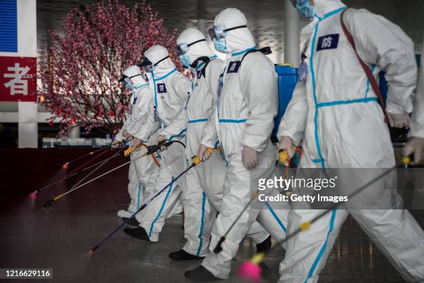 Firefighters disinfect the Wuhan Tianhe International Airport on April 3, 2020 in Wuhan, Hubei Province, China. Wuhan, the Chinese city hardest hit...