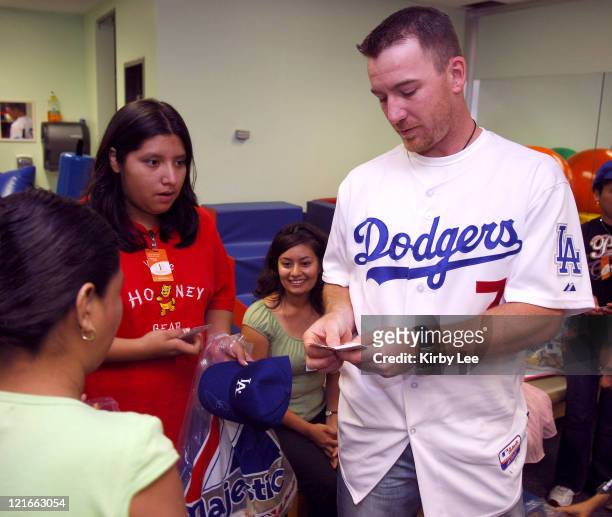 Drew of the Los Angeles Dodgers signs autographs during a visit to the White Memorial Medical Center Pediatric Unit in Los Angeles, Calif. On Tuesday...