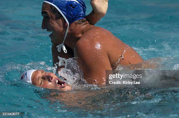 Jesse Smith of the USA is submerged by Hungary's Tamas Molnar in FINA Men's Water Polo World League match at Corona Del Mar High on Monday, July 5,...