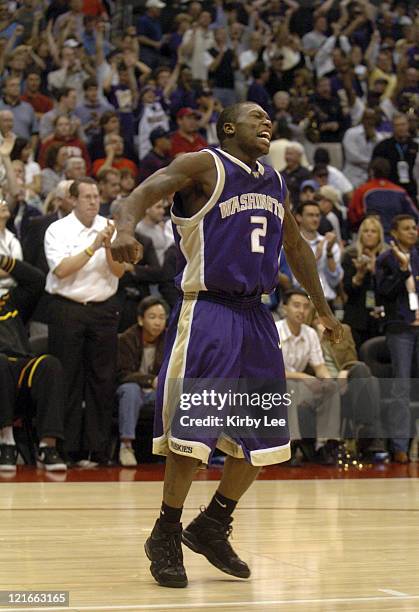 Nate Robinson of Washington celebrates 81-72 victory over Arizona in the Pacific Life Pac-10 Tournament Championship at the Staples Center in Los...