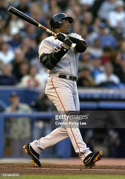 Barry Bonds of the San Francisco Giants hits his 678th career home run and 20th home run of the season on a three-run homer in the third inning...