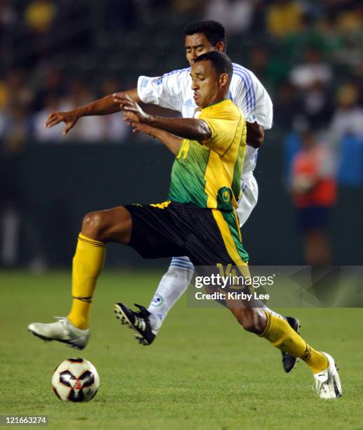 Tyrone Marshall of Jamaica beats Guatemala's Gonzalo Ramirez to ball during 4-3 victory in CONCACAF Gold Cup soccer match at the Home Depot Center in...