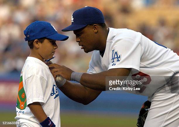 Adrian Beltre of the Los Angeles Dodgers signs autograph for fan before game against the Baltimore Orioles at Dodger Stadium on Tuesday, June 15,...