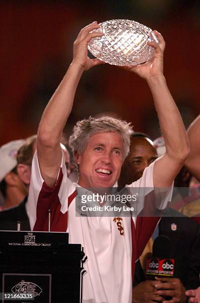 Coach Pete Carroll holds BCS Championship trophy after 55-19 victory over Oklahoma in the FedEx Orange Bowl in Miami, Florida on January 4, 2005.