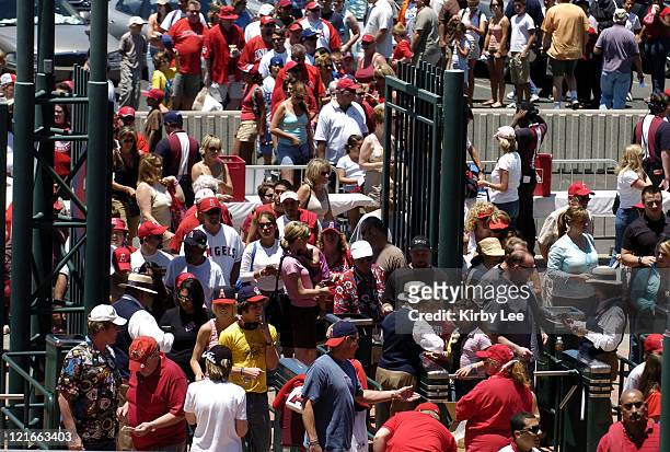 Fans go through a security checkpoint to enter Angel Stadium before Los Angeles Angels of Anaheim game against the Florida Marlins in Anaheim,...