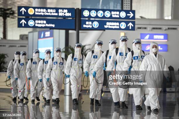 Firefighters prepare to conduct disinfection at the Wuhan Tianhe International Airport on April 3, 2020 in Wuhan, Hubei Province, China. Wuhan, the...