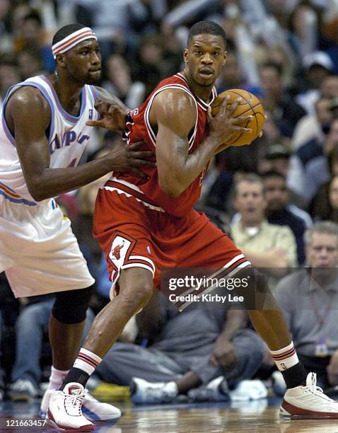 Antonio Davis of the Chicago Bulls is defended by Elton Brand of the Los Angeles Clippers during the game between the Los Angeles Clippers and the...