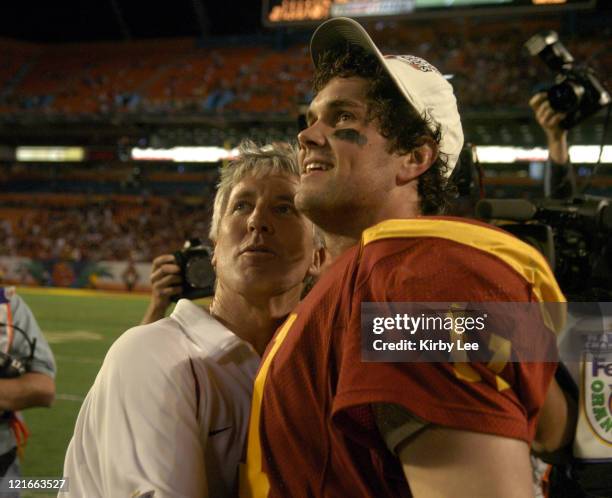 Coach Pete Carroll hugs quarterback Matt Leinart in the final minute of 55-19 victory over Oklahoma in the FedEx Orange Bowl at Pro Player Stadium in...