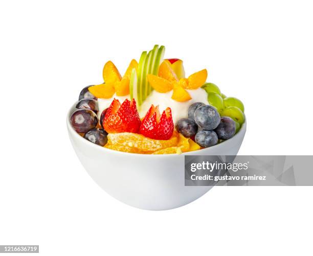 fruit salad with granola - fruit salad stock pictures, royalty-free photos & images