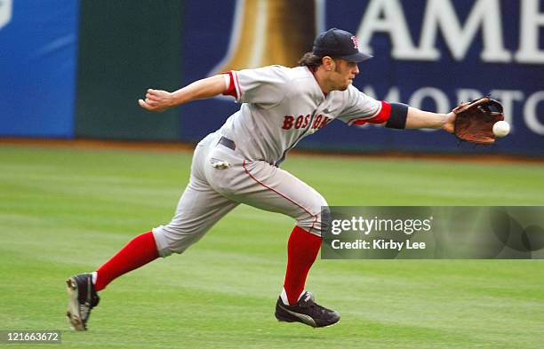 Mark Bellhorn of the Boston Red Sox stretches for a ground ball by Mark Ellis of the Oakland Athletics during 13-6 loss at McAfee Coliseum in...