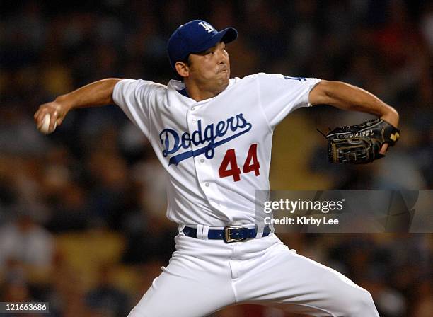 Los Angeles Dodgers Japanese reliever Takashi Saito pitches in the ninth inning of 2-0 victory over the Cincinnati Reds to pick up his 11th save at...