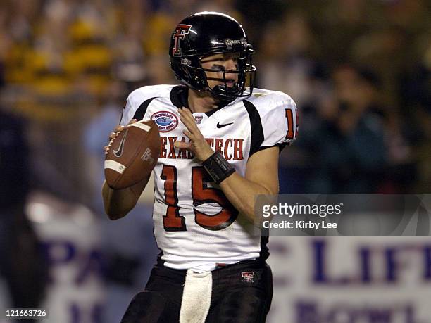 Texas Tech quarterback Sonny Cumbie drops back to pass during 45-31 victory over Cal in the Pacific Life Holiday Bowl at Qualcomm Stadium in San...