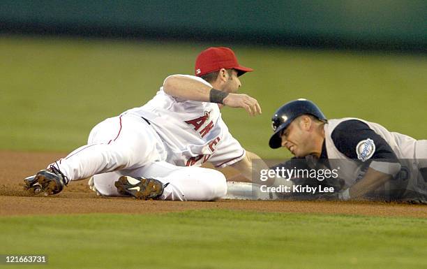 David DeJesus of the Kansas City Royals is tagged out by Adam Kennedy of the Anaheim Angels after trying to stretch a single into a double in the...