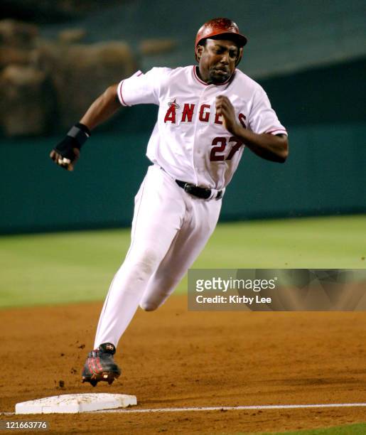 Vladimir Guerrero of the Los Angeles Angels of Anaheim rounds third base to score in the third inning of 7-4 victory over the Texas Rangers at Angel...
