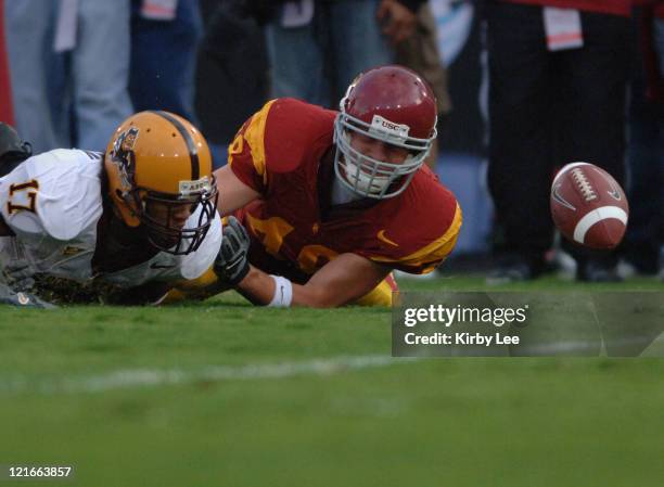 Matthew Jordan of USC chases a fumbled punt by Arizona State's Terry Richardson during Pacific-10 Conference game at the Los Angeles Memorial...