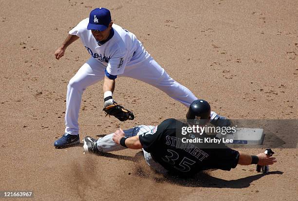 Oscar Robles of the Los Angeles Dodgers tags out Kelly Stinnett of the Arizona Diamondbacks at second base in the seventh inning of 7-5 loss at...