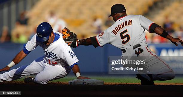 Ray Durham of the San Francisco Giants tags out Oscar Robles of the Los Angeles Dodgers at second base on a stolen base attempt in the first inning...
