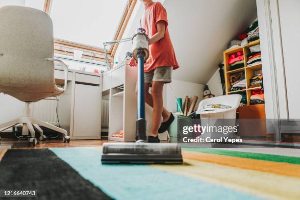 low section male teenager with vacuum cleaner bedroom - tidy bedroom stock pictures, royalty-free photos & images