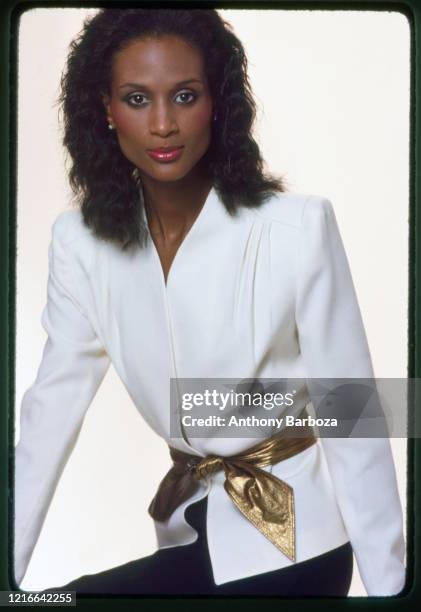 Portrait of American fashion model and actress Beverly Johnson as she poses against a white background, New York, 1970s.