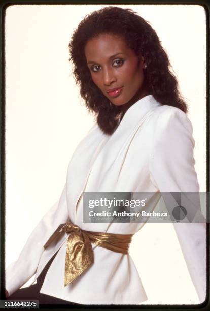 Portrait of American fashion model and actress Beverly Johnson as she poses against a white background, New York, 1970s.