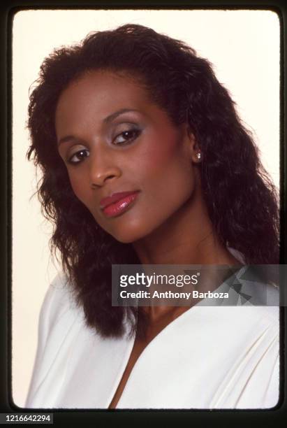 Portrait of American fashion model and actress Beverly Johnson as she poses against a white background, New York, 1970s.