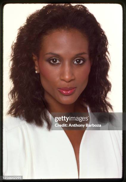 Portrait of American fashion model and actress Beverly Johnson as she poses against a white background, New York, 1970s.