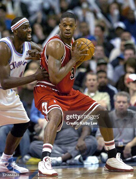 Antonio Davis of the Chicago Bulls is defended by Elton Brand of the Los Angeles Clippers during the game between the Los Angeles Clippers and the...