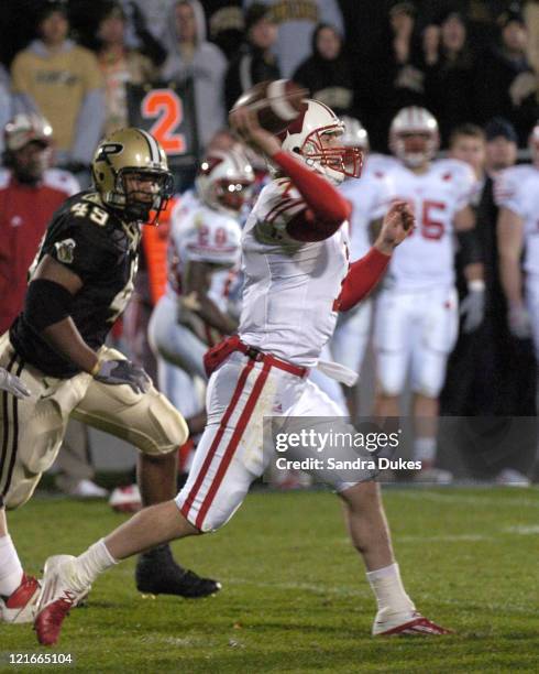 Wisconsin's John Stocco passes as Anthony Spencer closes in in Wisconsin's 20-17 win over Purdue in Ross Ade Stadium.