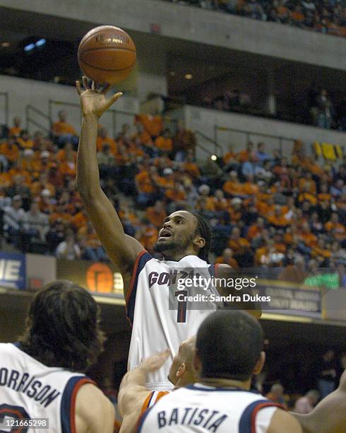 Ronny Turiaf lofts a soft shot toward the hoop in the second half of Illinois 89-70 win in the John Wooden Tradition in Conseco Fieldhouse,...