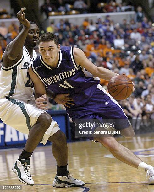 Vedran Vukusic of Northwestern drives past Kelvin Torbert in the first half of Michigan State's 68-55 win.