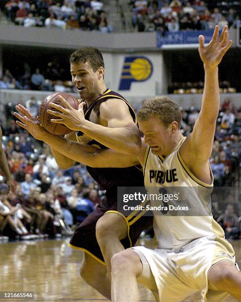 Kris Humphries and Purdue's Brett Buscher fight for a rebound in the first half of Minnesota's 63-52 win.